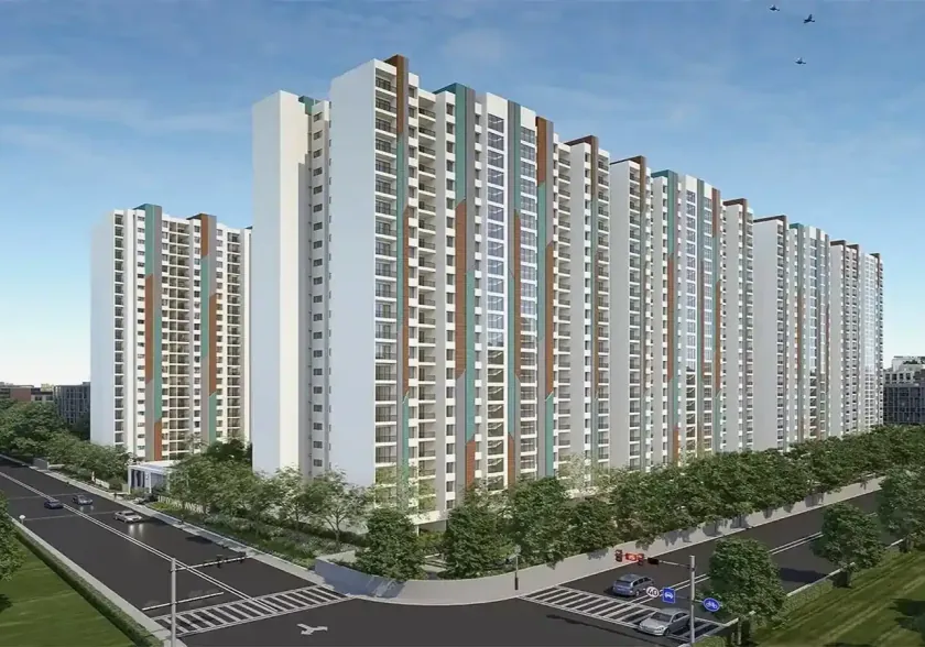 The towers of Kohinoor Boulevard Towers along a tree-lined road